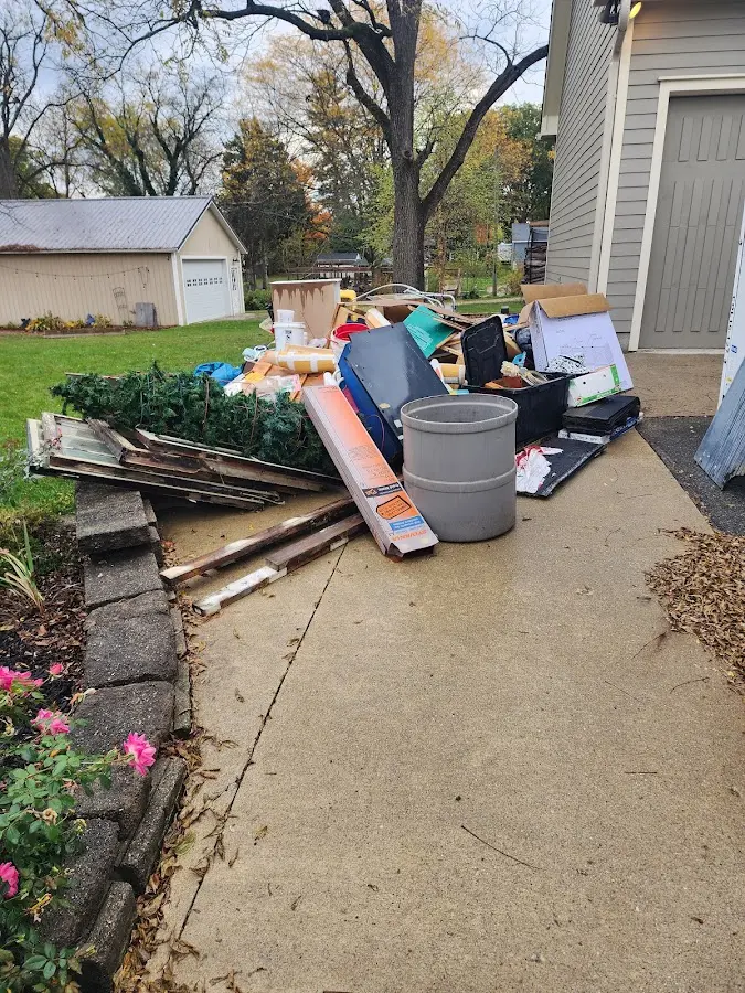 Dumpster being loaded with debris for 3 Yard Dumpster Rental in Frederick